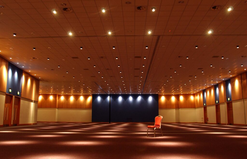 One of the programme rooms that we'll have access to, containing one lonely red chair.